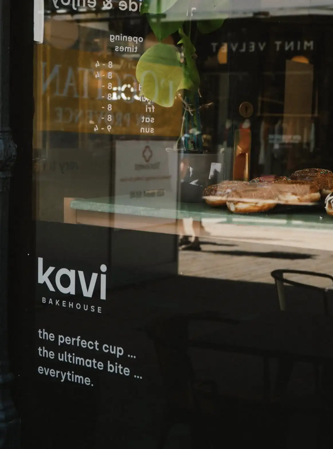 the kavi bakehouse window with pastries on the counter